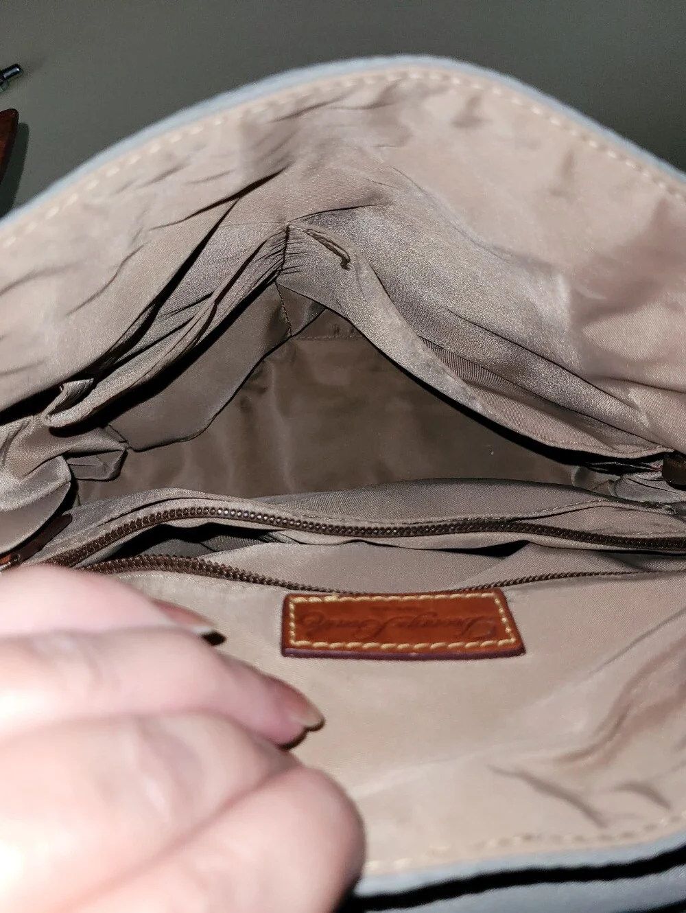 Dooney & Bourke Light Gray Nylon Backpack with Brown Leather Trim.